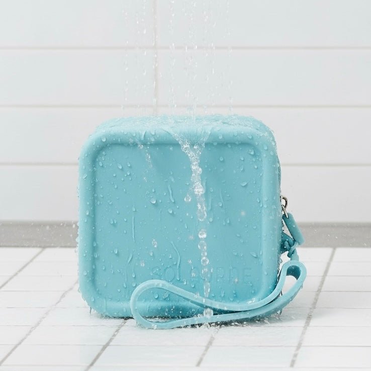 lumi beauty essentials travel case with water pouring over it - Solaurae